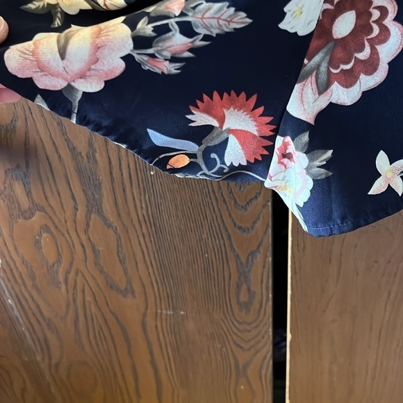 One❤️Clothing navy blue floral long sleeved romper. Size XS. Open V in the back. - Picture 9 of 14